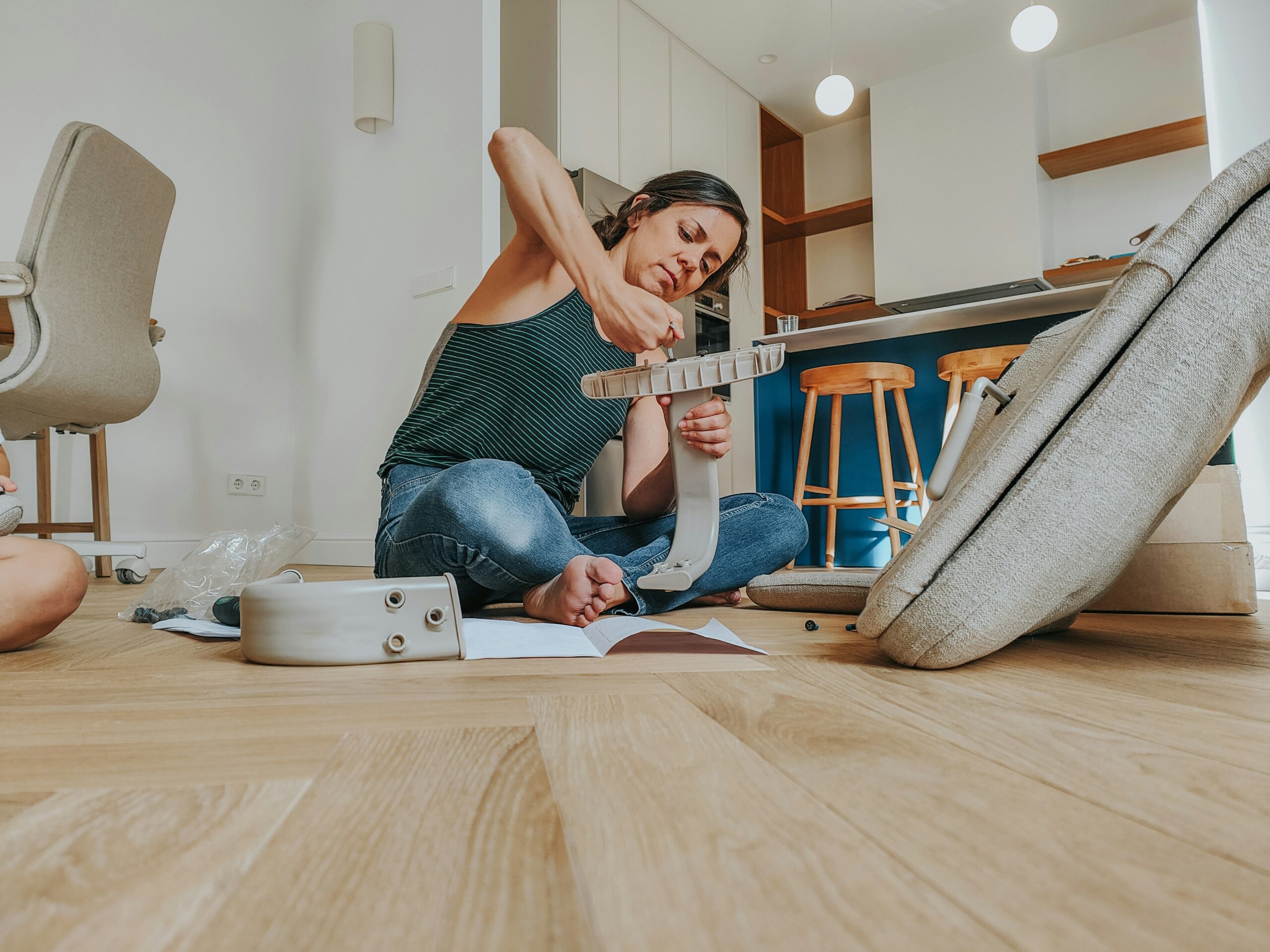 Stock photo of women assembling furniture. 